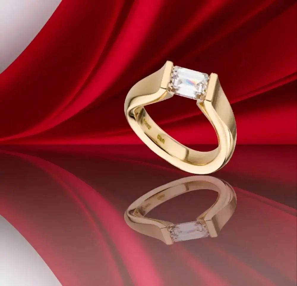 A gold ring with a diamond on it