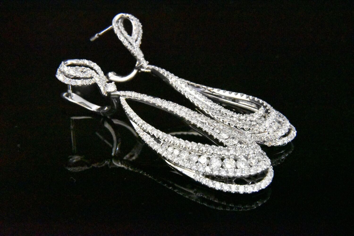 Diamond dangle earrings, elegant sparkle.