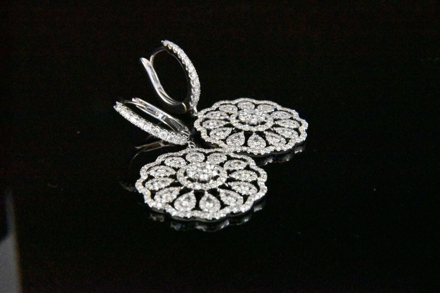 Diamond flower earrings, elegant jewelry.