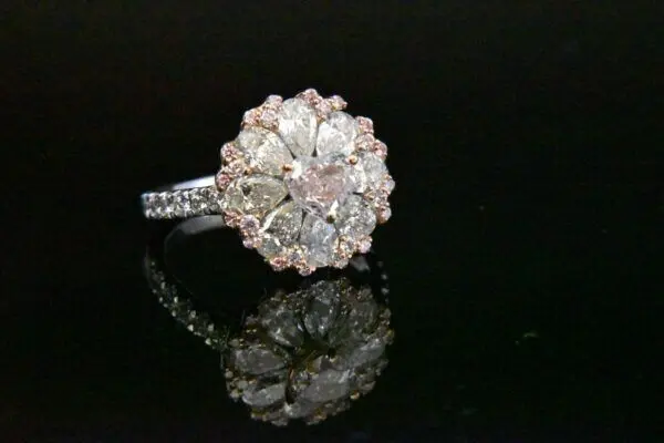 Diamond ring with pink and white stones.