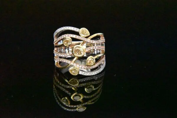 Diamond ring with yellow and white stones.