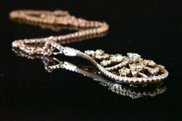 Rose gold diamond pendant necklace.