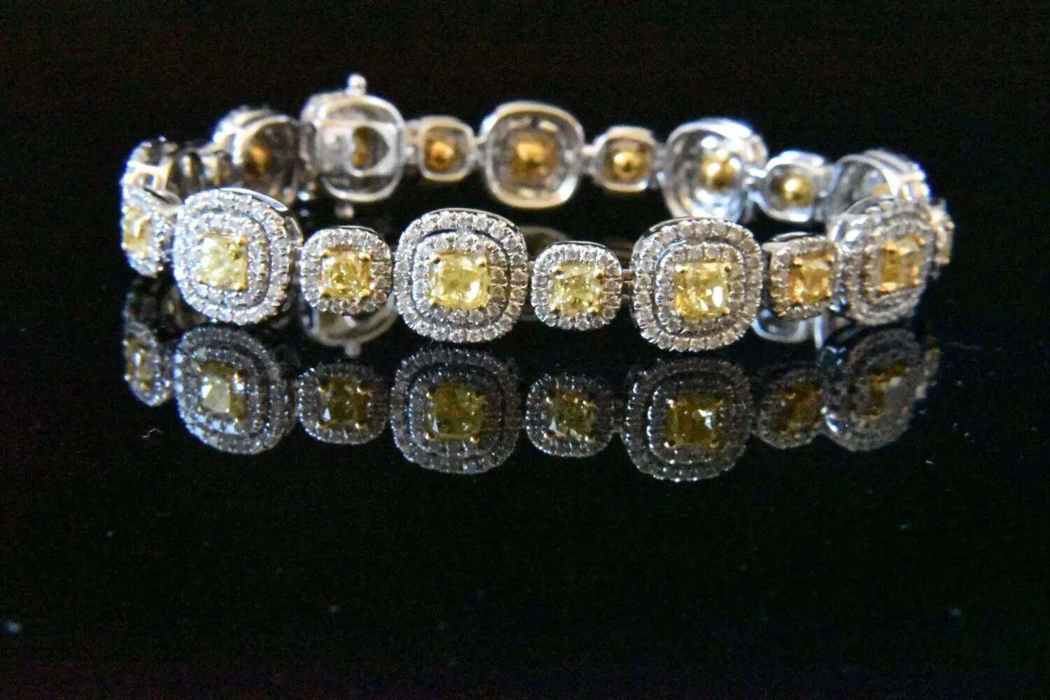 Diamond bracelet with yellow gemstones.