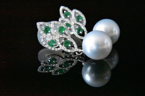 Elegant emerald and pearl earrings.