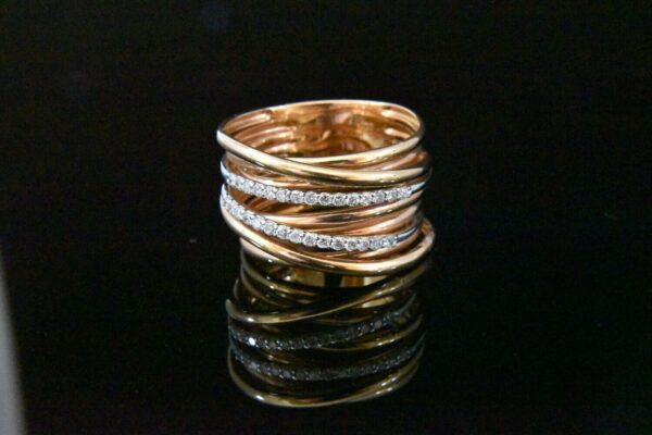 Rose gold ring with diamond bands.