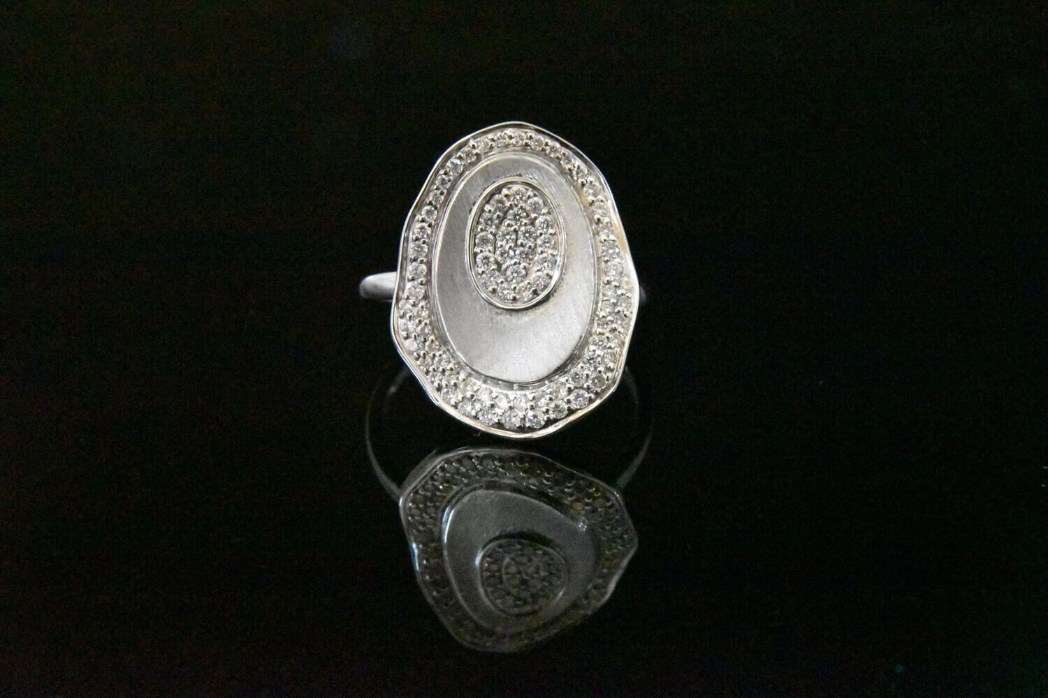 Diamond ring, oval, silver setting.