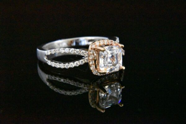 Diamond ring with halo and split shank.