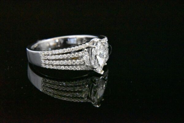 Diamond marquise ring with pave setting.