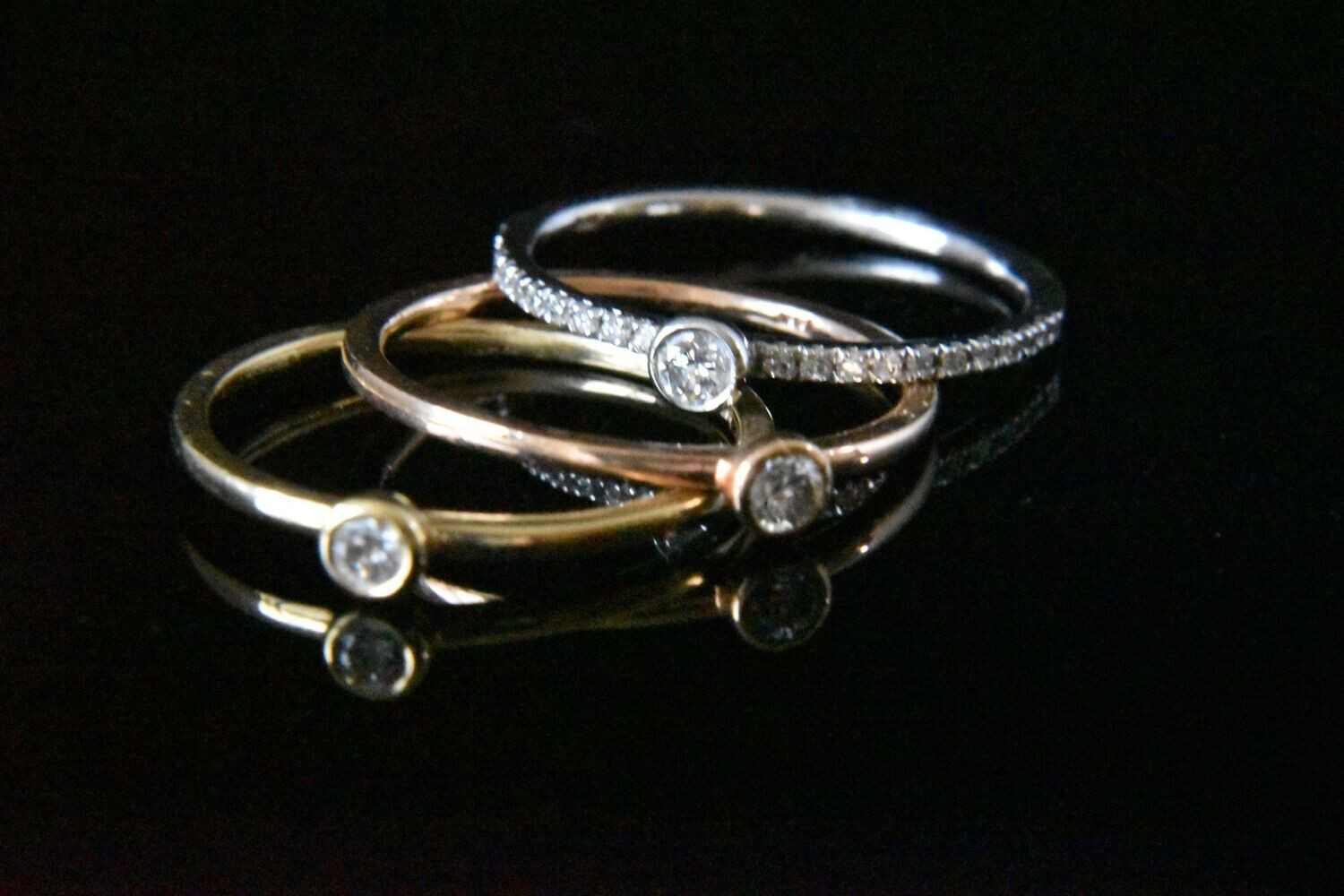 Three diamond rings, gold and white gold.