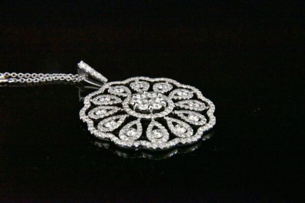 Diamond floral pendant necklace.