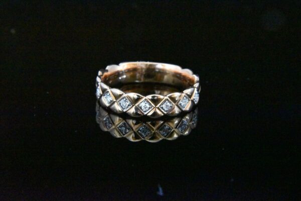 Rose gold diamond band ring.