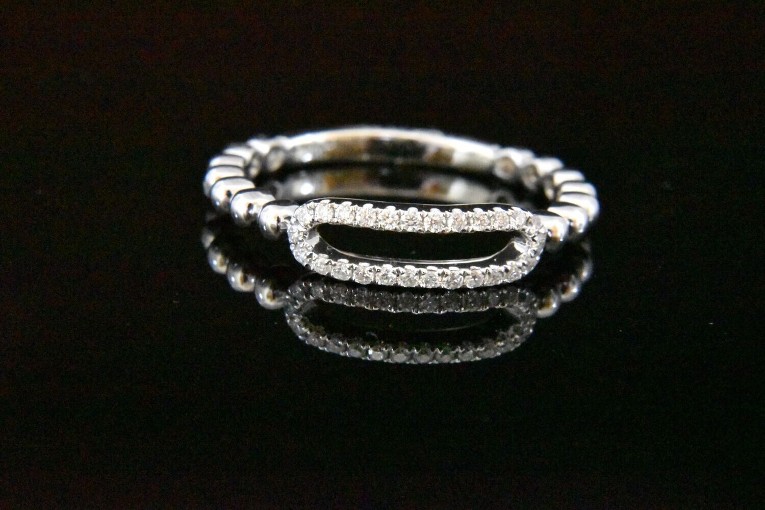 Diamond ring with beaded band.