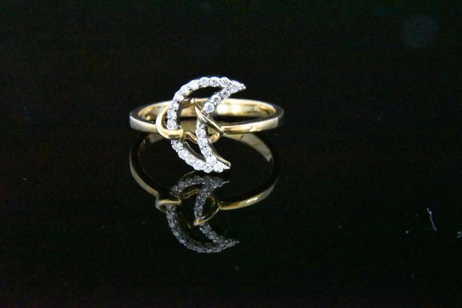 Diamond crescent moon and star ring.