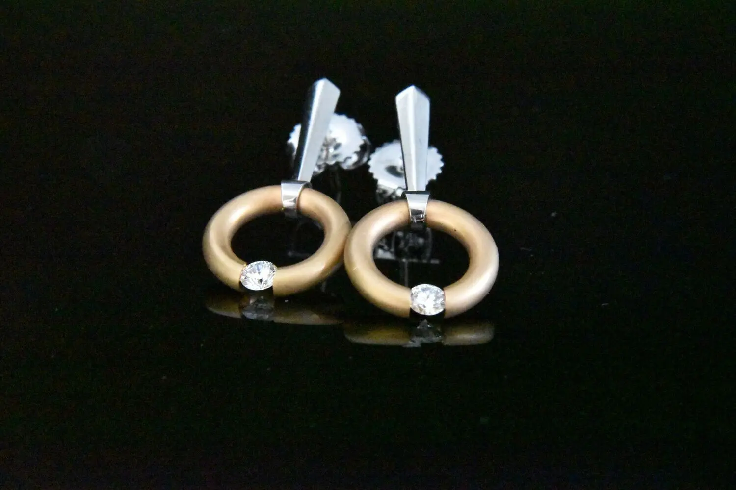 Diamond circle earrings, gold and white.