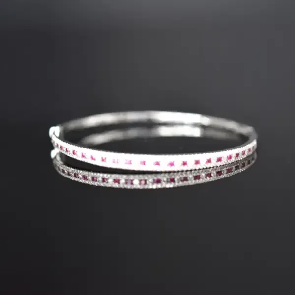 Elegant ruby and diamond bangle bracelet.