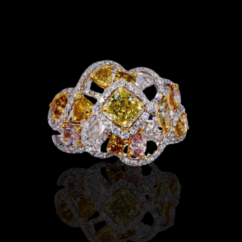 Multicolored diamond ring on black background.