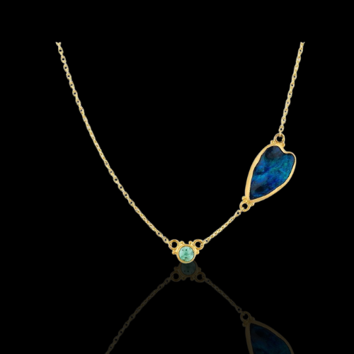 Gold necklace with blue opal and gemstone.