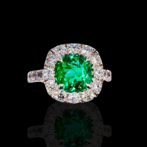 Emerald and diamond halo ring.