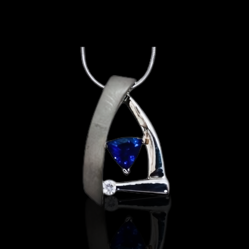 Elegant sapphire and diamond pendant.