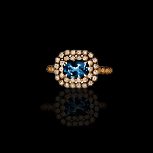 Blue gemstone ring with gold and pearl accents.