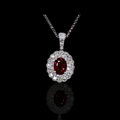 Oval ruby and diamond pendant necklace.