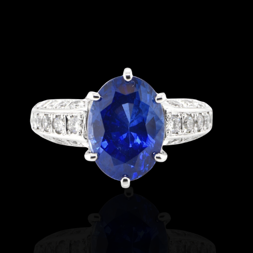 Oval sapphire ring with diamond band.