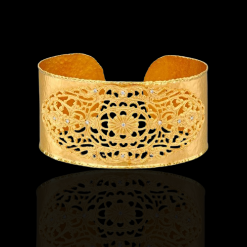 Gold filigree cuff bracelet with diamonds.