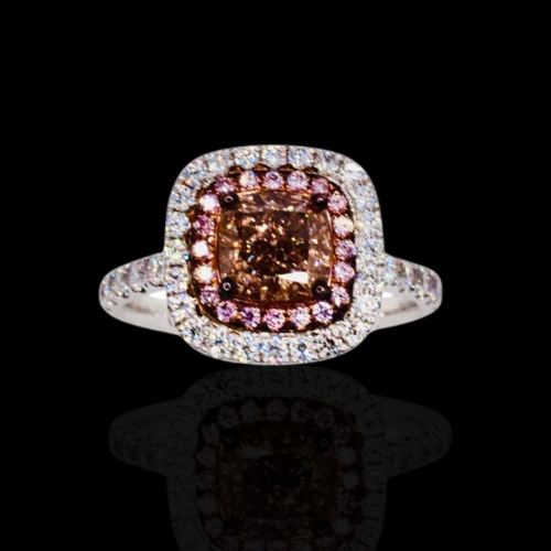 Champagne diamond ring with pink halo.