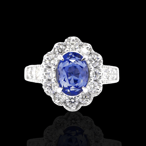 Oval sapphire ring with diamond halo.