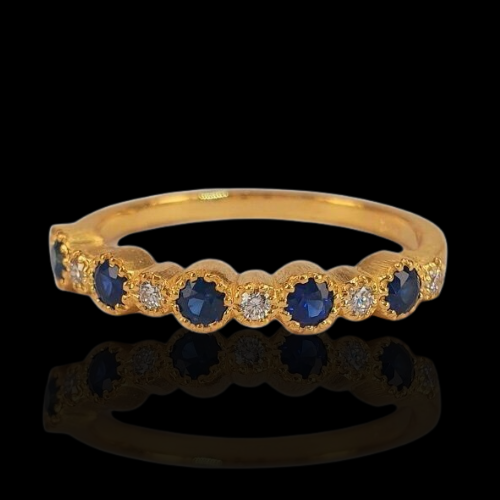 Gold ring with sapphires and diamonds.