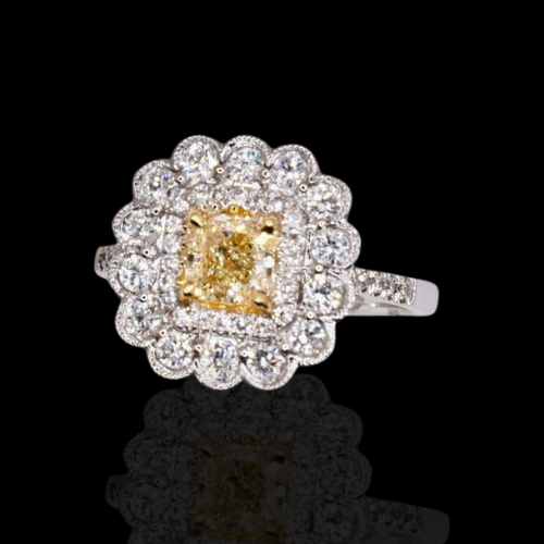 Diamond ring with yellow center stone.